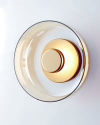 Wandlampe aus Gold und Glas