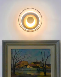 Wandlampe aus Gold und Glas